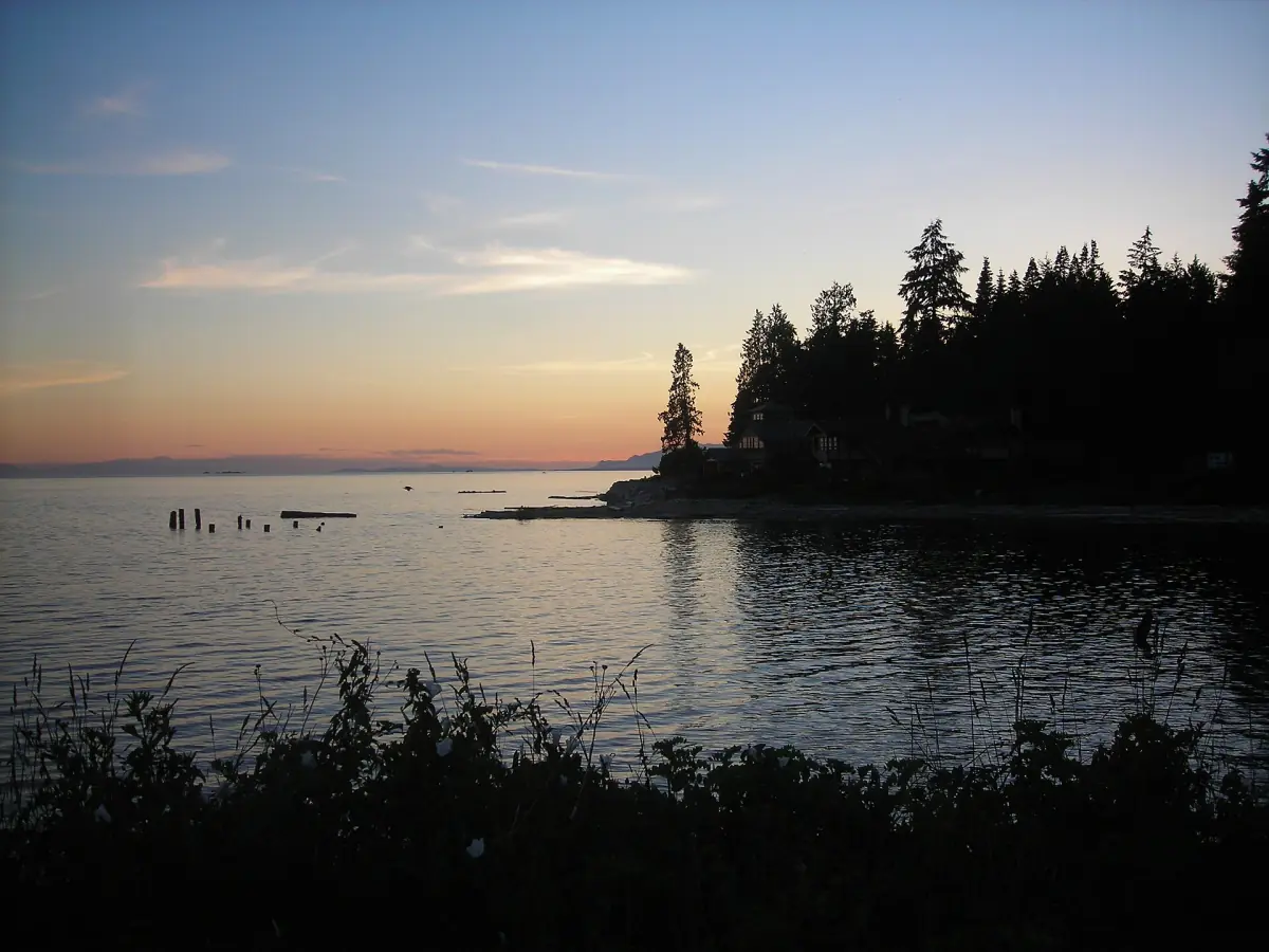 Sunset over the Strait of Georgia with a forested point at Roberts Creek