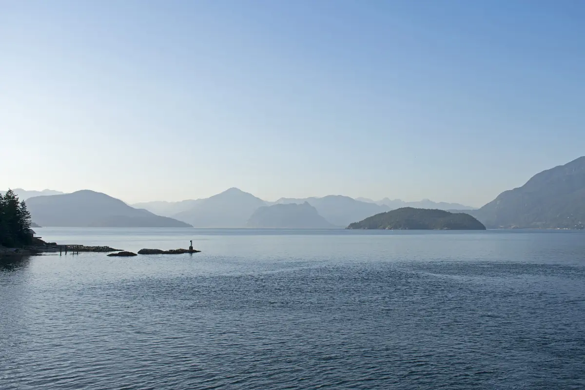 Hazy blue islands and mountain ridges in Howe Sound seen from Horseshoe Bay