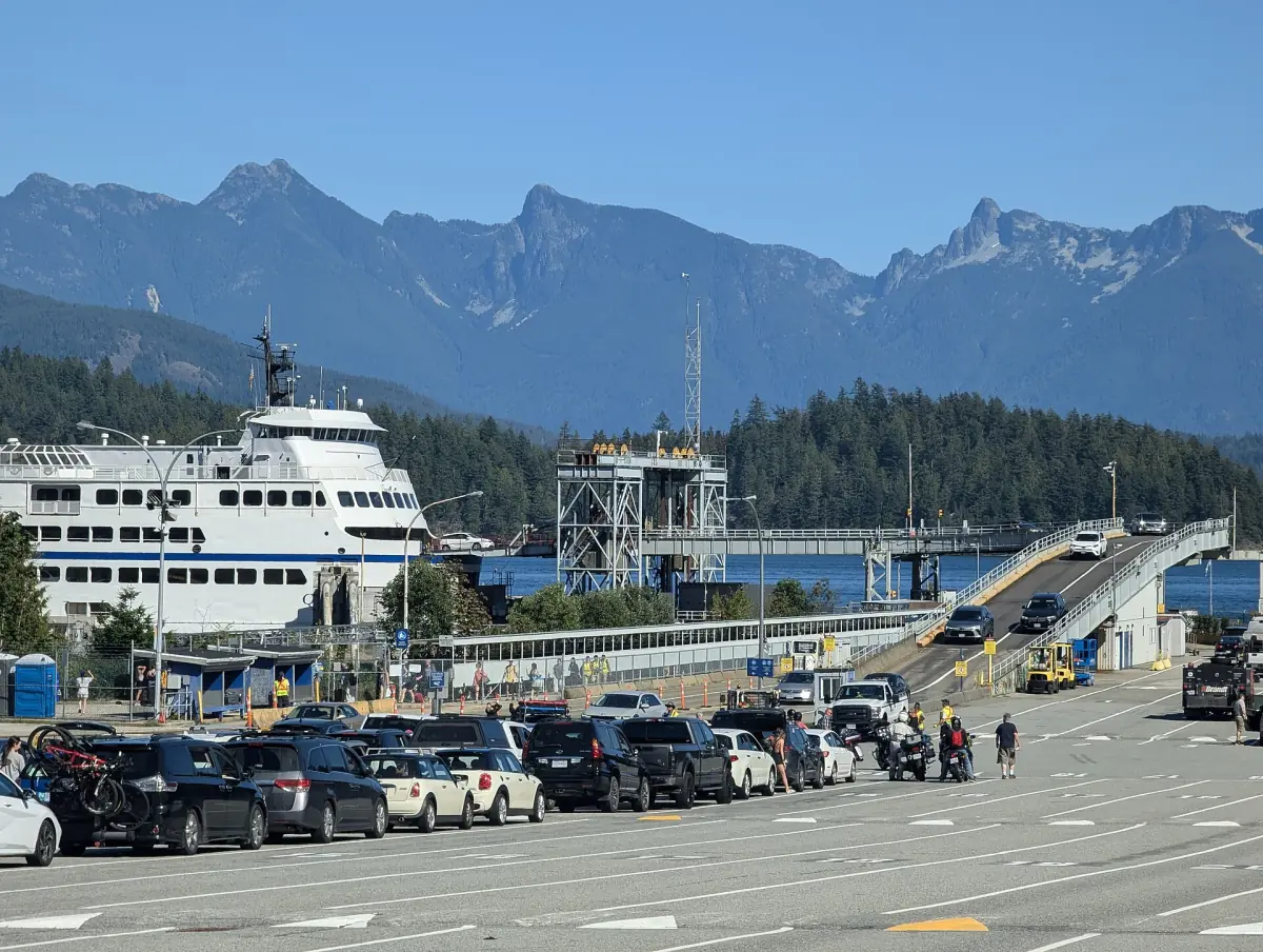 BC Ferries vessel at the Langdale terminal with cars lined up on the ramp