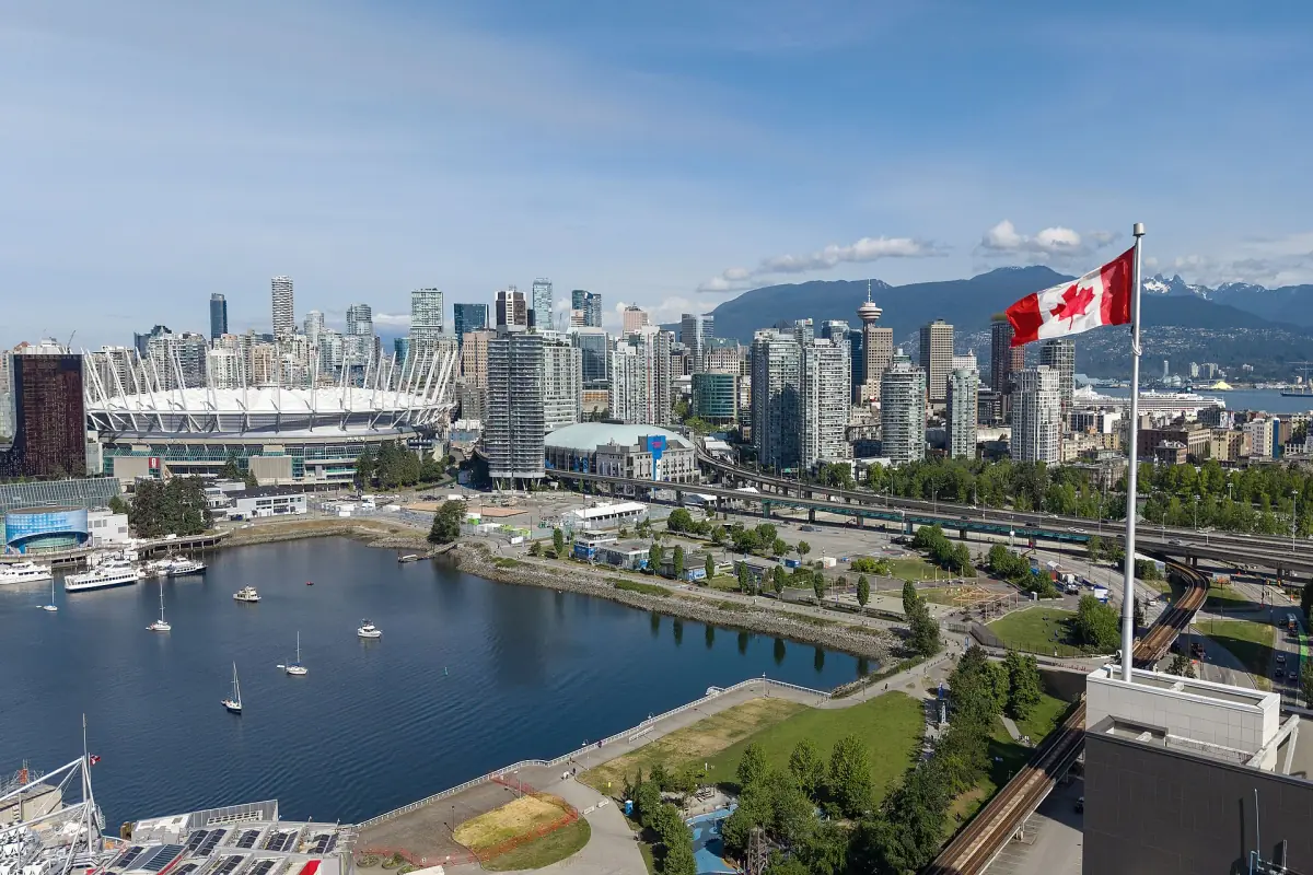Downtown Vancouver towers above the False Creek harbour on a sunny day