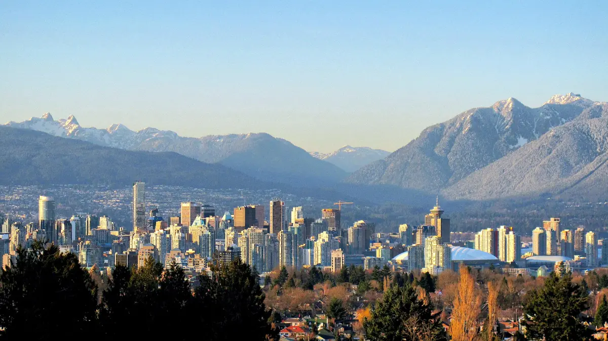 Vancouver skyline in golden light with the North Shore mountains behind